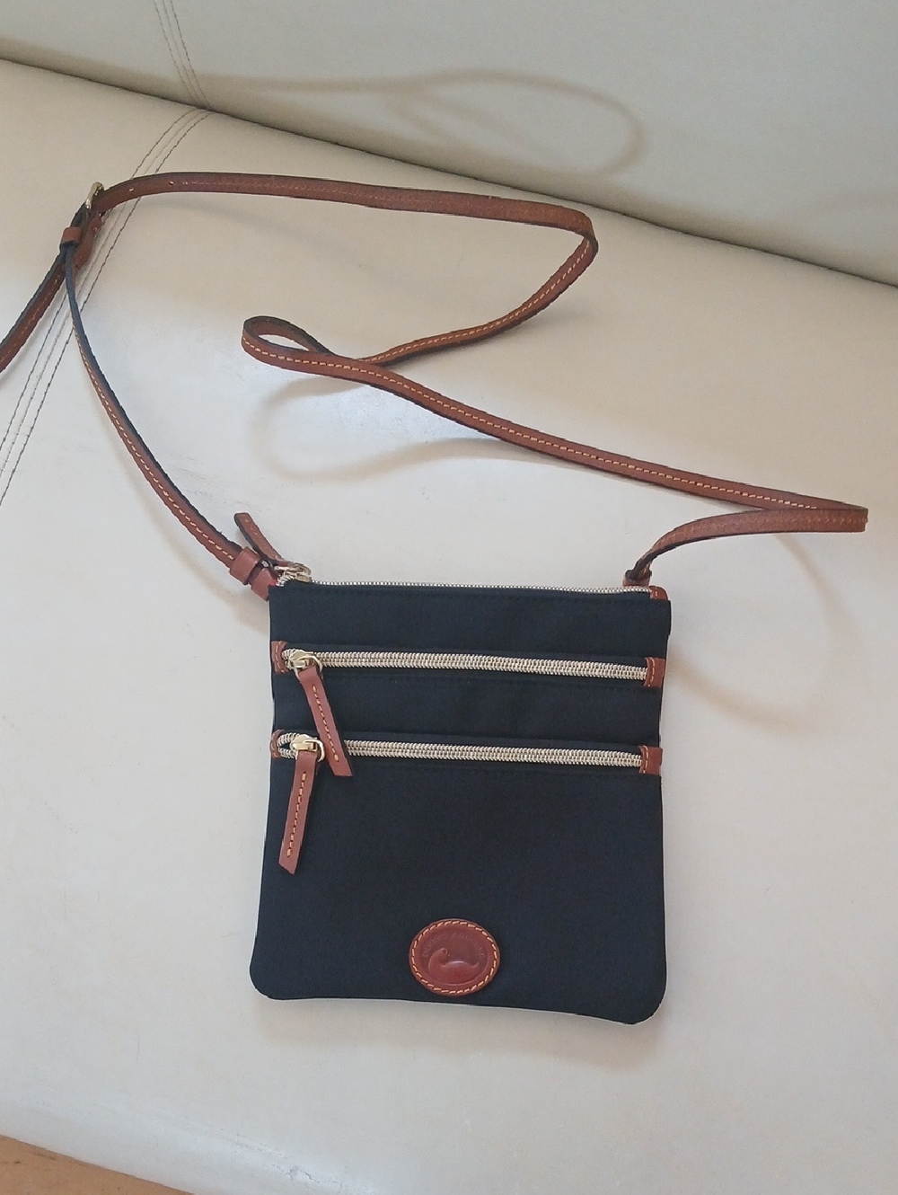 Dooney & Bourke Canvas Nylon Black Crossbody with Brown Trim and Gold Hardware
